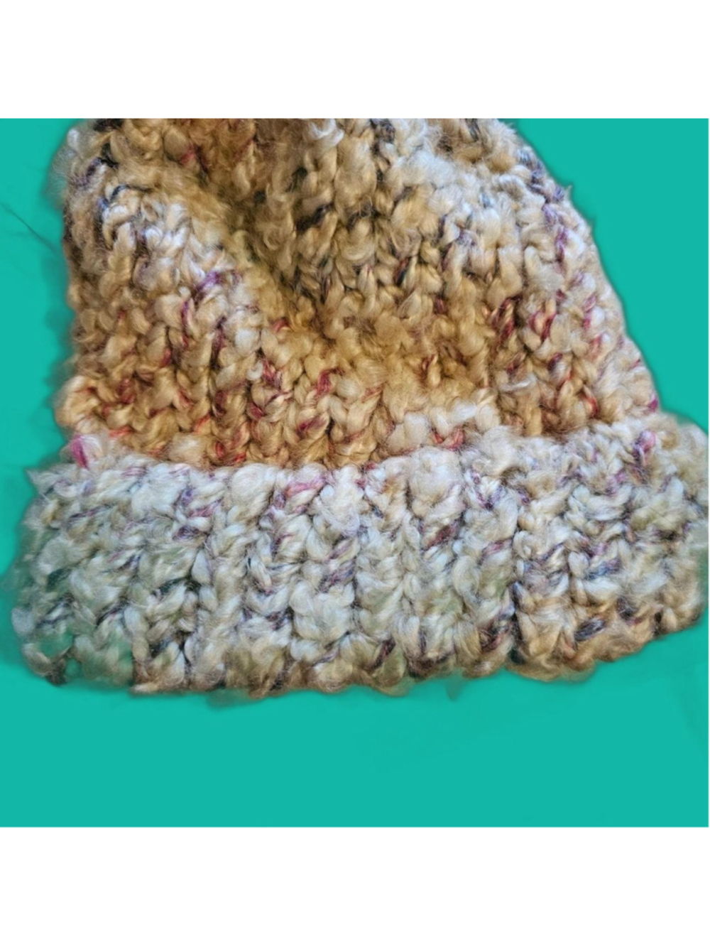 Multi-colored knit beanie with speckled beige, pink, and black yarn #winteracces